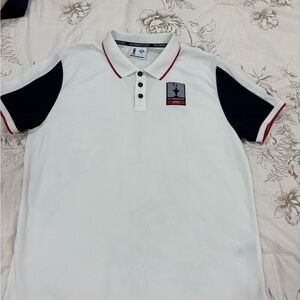 Prada White Polo with Blue and Red Trim . Never worn.